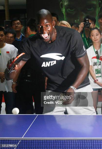 Kevin Garnett of Boston Celtics plays table tennis during ANTA commercial event on August 17, 2011 in Wuhan, Hubei Province of China.