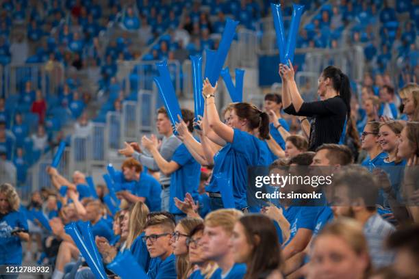 spectators cheering in stadium - basketball fans stock pictures, royalty-free photos & images