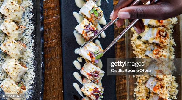 sushi rolls - sushi plate stock pictures, royalty-free photos & images