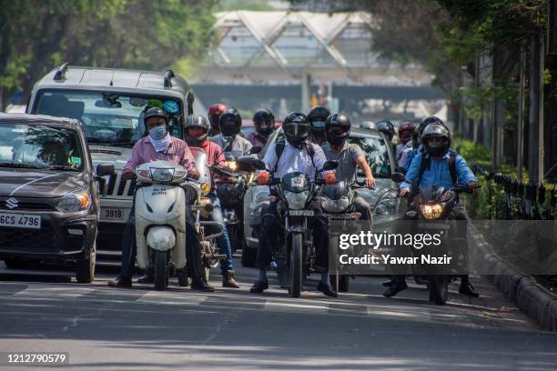 Vehicles wait for signal on a road, as India remains under an unprecedented extended lockdown over the highly contagious coronavirus on May 12, 2020...