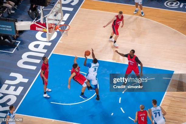 basketball players tackling for ball - red white jersey stock pictures, royalty-free photos & images