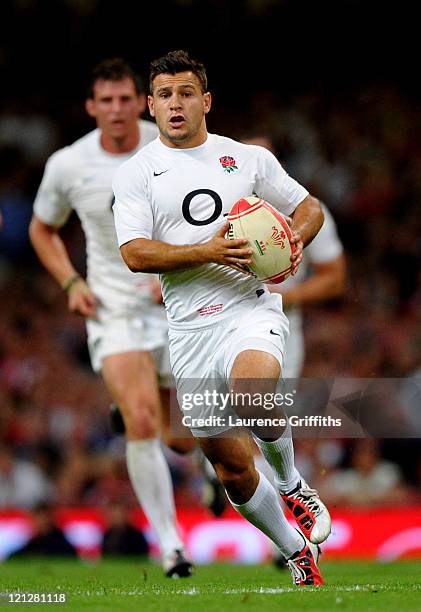 Scrumhalf Danny Care of England runs with the ball during the rugby union international friendly match between Wales and England at the Millennium...