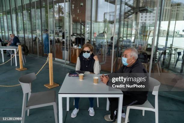 Two people drinking coffee, on a terrace of a bar in Santander, Spain, on May 12 which with the arrival of phase 1 of de-escalation, can already...