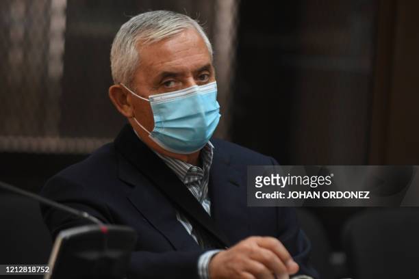 Imprisoned Guatemalan former president Otto Perez Molina, wears a face mask as a preventive measure against the spread of new COVID-19 coronavirus,...