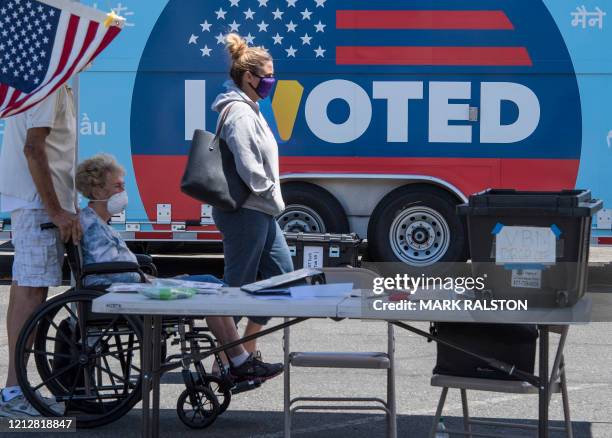 People wait to cast their votes at a polling station for the special election between Democratic state assemblywoman Christy Smith and Republican...