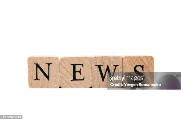news word made of wooden cubes, isolated on white background - abc news stock pictures, royalty-free photos & images