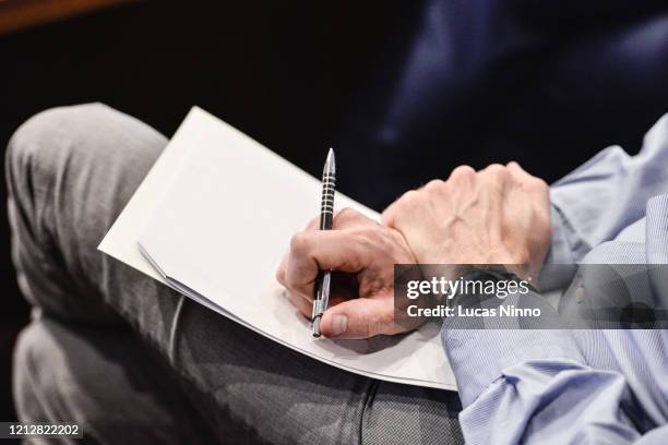 man holding blank paper - flyers business people stockfoto's en -beelden