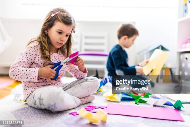kids making origami crafts with paper - paper craft stock pictures, royalty-free photos & images