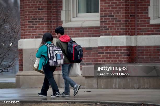 Students leave Lane Tech College Prep High School at the end of the school day on March 16, 2020 in Chicago, Illinois. Schools in the city have been...