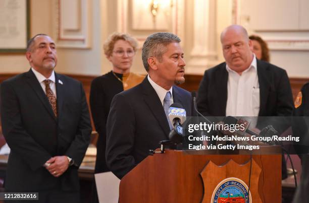 Reading, PA Reading Managing Director Pedro Cortes speaks in Reading City Council Chambers, back from left are Reading Mayor Eddie Moran, U.S....