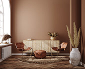 Home interior with ethnic boho decoration, living room in brown warm color