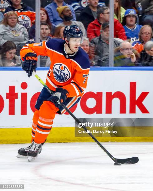 Oscar Klefbom of the Edmonton Oilers plays the puck down the ice during third period action against the Winnipeg Jets at Rogers Place on March 11,...