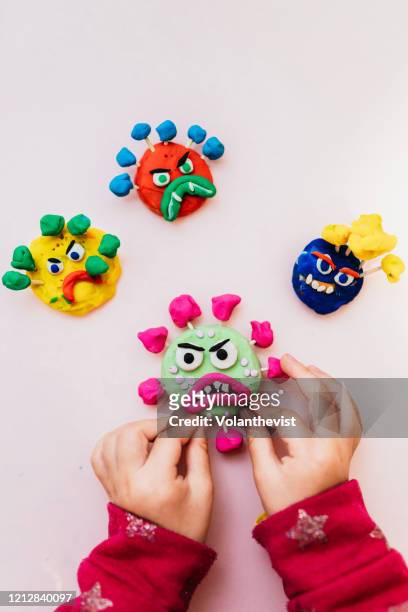kid handmade coronavirus ugly monsters made with plasticine - clay photos et images de collection