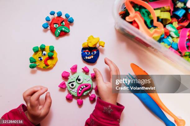 kid handmade coronavirus ugly monsters made with plasticine - social distancing fotografías e imágenes de stock