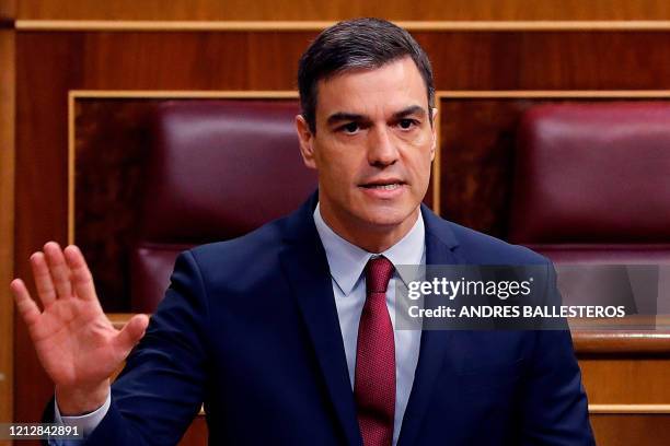 Spanish Prime Minister Pedro Sanchez delivers a speech during question time at the Lower House in Madrid on May 13, 2020. - One of the world's...