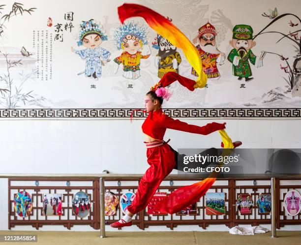 Children practice basic skills of Peking Opera. Hai'an City, Jiangsu Province, China, May 13, 2020.-