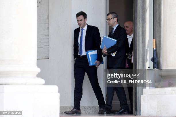 French Minister for Solidarity and Health Olivier Veran and Elysee palace general secretary Alexis Kohler speak after the first Ministers Council...