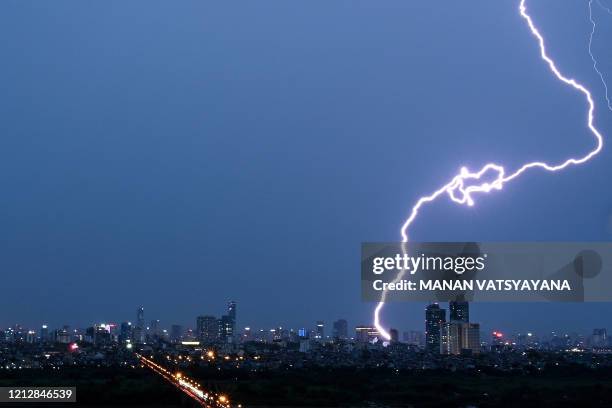 Lightning strikes over the Hanoi skyline on May 13, 2020.