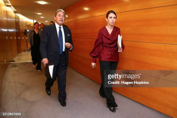 Prime Minister Jacinda Ardern and Deputy Prime Minister Winston Peters arrive at a press conference following a COVID-19 financial response package...