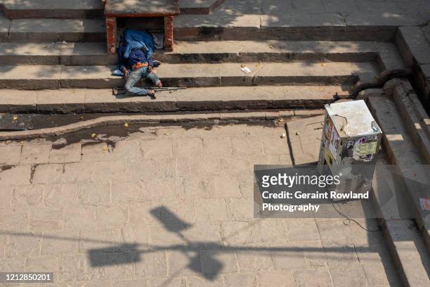 hungry & homeless in india - indian crutch stock pictures, royalty-free photos & images