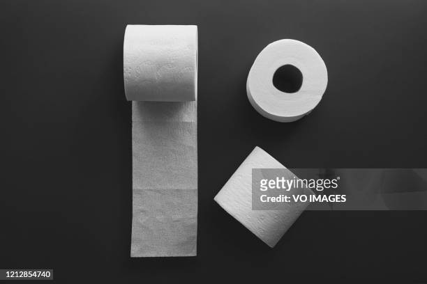 toilet paper rolls on a black background. toilet tissue. - no toilet paper stock pictures, royalty-free photos & images