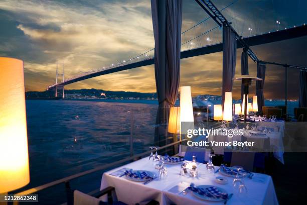 luxurious restaurant and nightclub in bosporus istanbul turkey - istanbul restaurant stock pictures, royalty-free photos & images