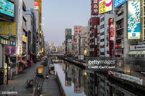 The Dotonbori area, one of Osaka's most popular tourist sights, is pictured noticeably quiet on May 13, 2020 in Osaka, Japan. Japan's Prime Minister,...