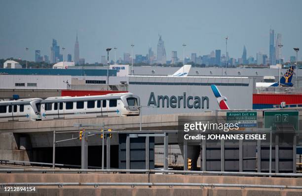 The American Airlines logo is seen at John F. Kennedy Airport is seen amid the novel coronavirus pandemic on May 13, 2020 in Queens, New York.