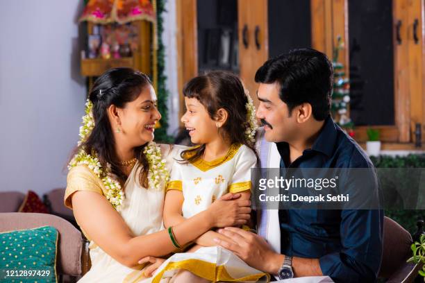 south indian young family with classic look stock photo - south india stock pictures, royalty-free photos & images