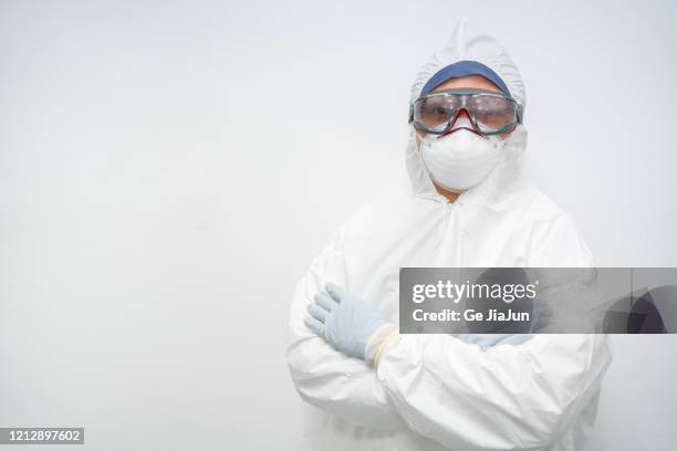 cdc staff standing in front of the white background wall - ebola hospital stock pictures, royalty-free photos & images