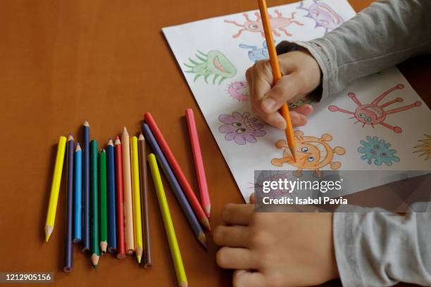 boy hands drawing picture - coloring crayons stock pictures, royalty-free photos & images