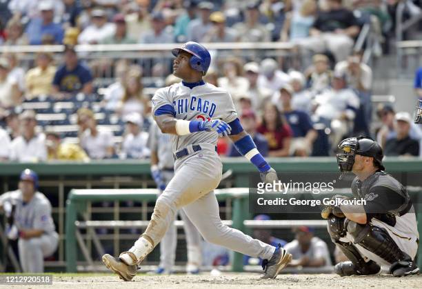 Sammy Sosa of the Chicago Cubs bats against the Pittsburgh Pirates as catcher Jason Kendall looks on during a Major League Baseball game at PNC Park...