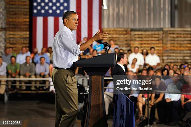 President Barack Obama speaks at a town hall-style meeting at Wyffels Hybrids Inc. On August 17, 2011 in Atkinson, Illinois. President Obama is on...