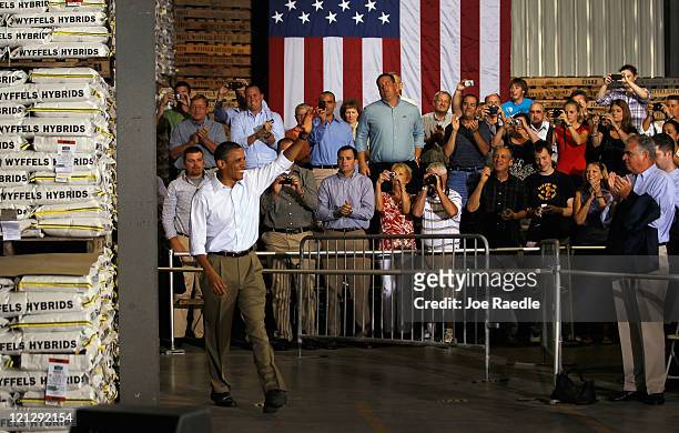 President Barack Obama waves as he is introduced at a town hall-style meeting at Wyffels Hybrids Inc. On August 17, 2011 in Atkinson, Illinois....