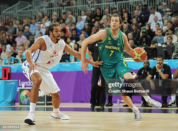 Joe Ingles of Australia is challenged by Noah Joakim of France during the London Prepares Series match between France and Australia at the Basketball...