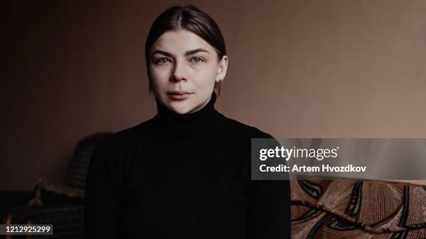 young woman with a pained expression. scared look - pain face portrait bildbanksfoton och bilder