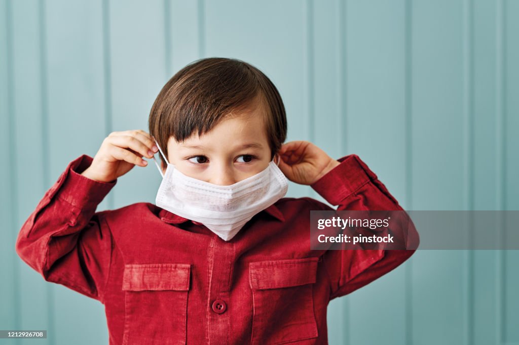 2-3 years old cute child wearing surgical mask.