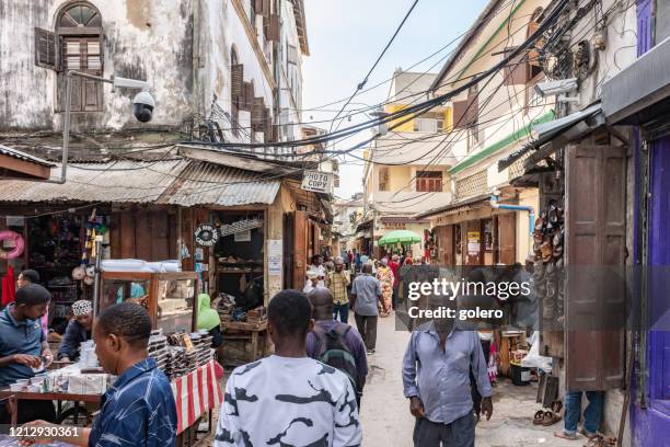 colorful shopping street of stone town - stone house stock pictures, royalty-free photos & images