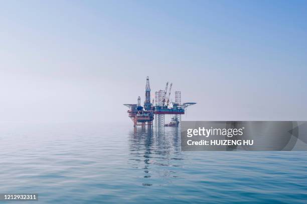offshore oil rig in east china sea - drilling rig stockfoto's en -beelden