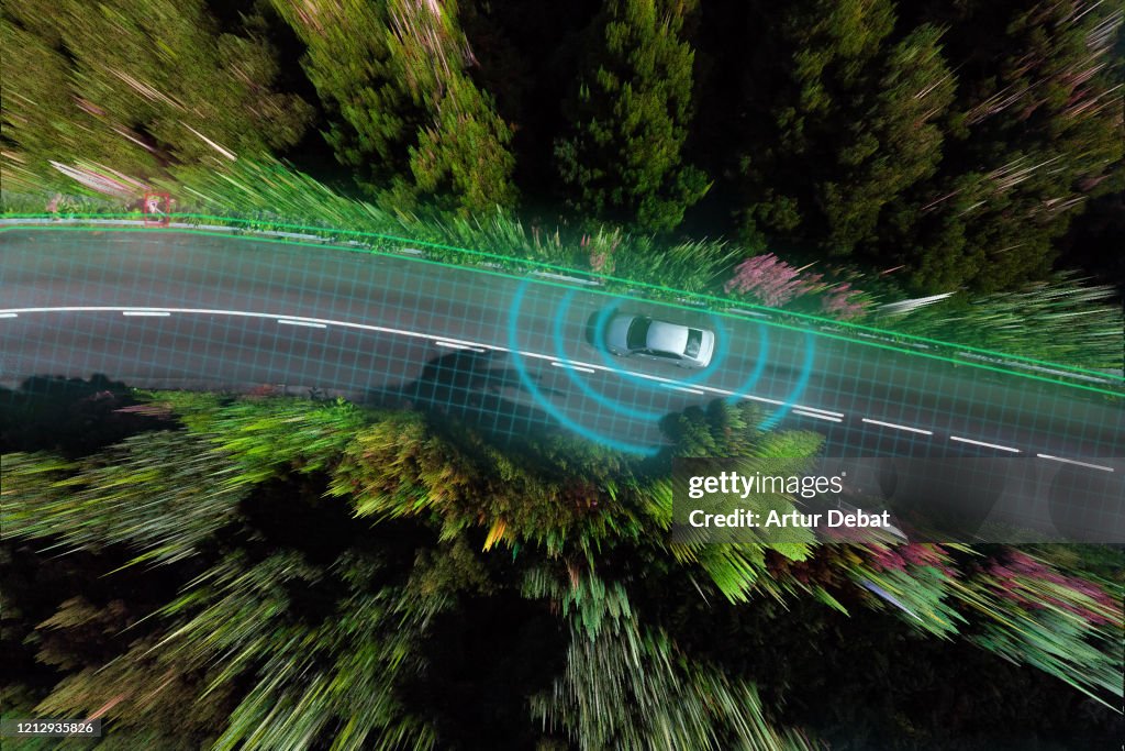 Smart car evaluating the road with sensors and futuristic technology.