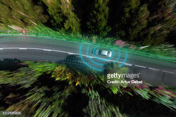 smart car evaluating the road with sensors and futuristic technology. - smart car - fotografias e filmes do acervo