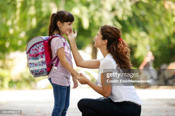 mother sending daughter to school - sending stock pictures, royalty-free photos & images