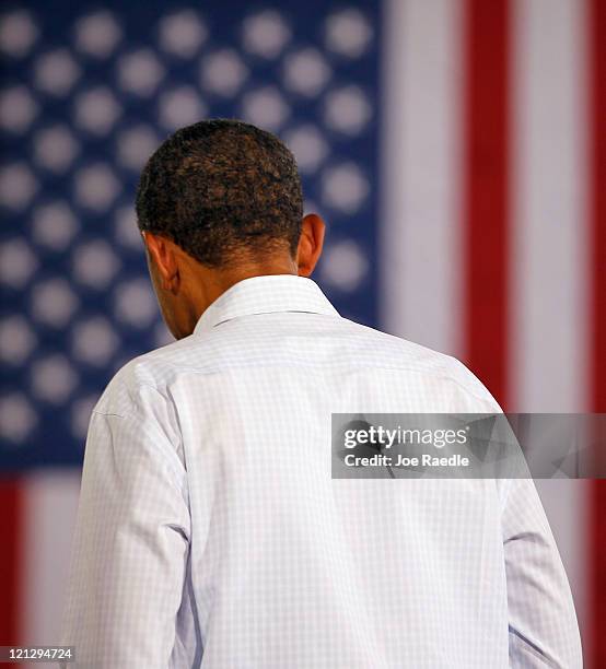 President Barack Obama speaks at a town hall-style meeting at Wyffels Hybrids Inc. On August 17, 2011 in Atkinson, Illinois. President Obama is on...
