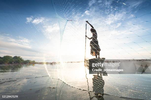 the fisherman village catching fish with net and yokyor pakpra pattalung thailand - southeast stock pictures, royalty-free photos & images
