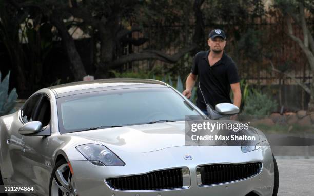 Leonardo DiCaprio seen driving the new 2012 Fisker Karma on August 17, 2011 in Los Angeles, California. When fully charged, this plug in hybrid...