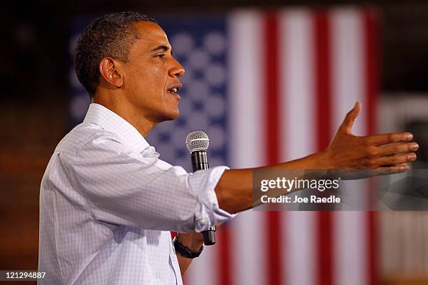 President Barack Obama speaks at a town hall-style meeting at Wyffels Hybrids Inc. On August 17, 2011 in Atkinson, Illinois. President Obama is on...