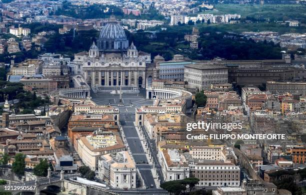 This aerial photograph taken on May 1, 2020 shows St Peter's square and St. Peter's Basilica in the Vatican, during the country's lockdown aimed at...