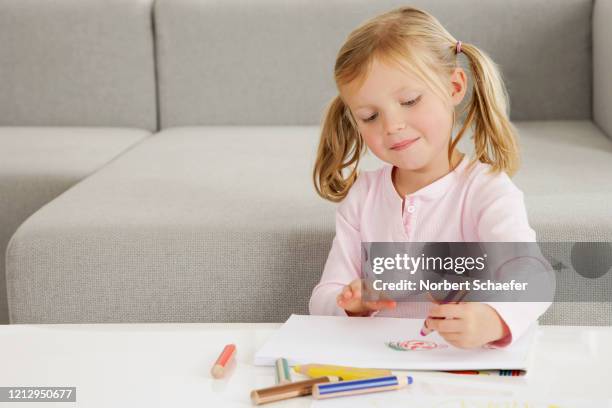 little girl drawing - kid holding crayons stock pictures, royalty-free photos & images