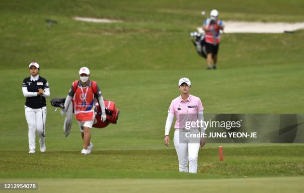 South Korean golfer Park Sung-hyun walks on the 18th fair way during the first round of the 42nd KLPGA Championship at Lakewood Country Club in...