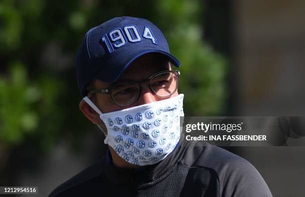 Schalke 04's German headcoach David Wagner walks with a face mask from the hotel, where the team stays in quarantine, to the club's training grounds...